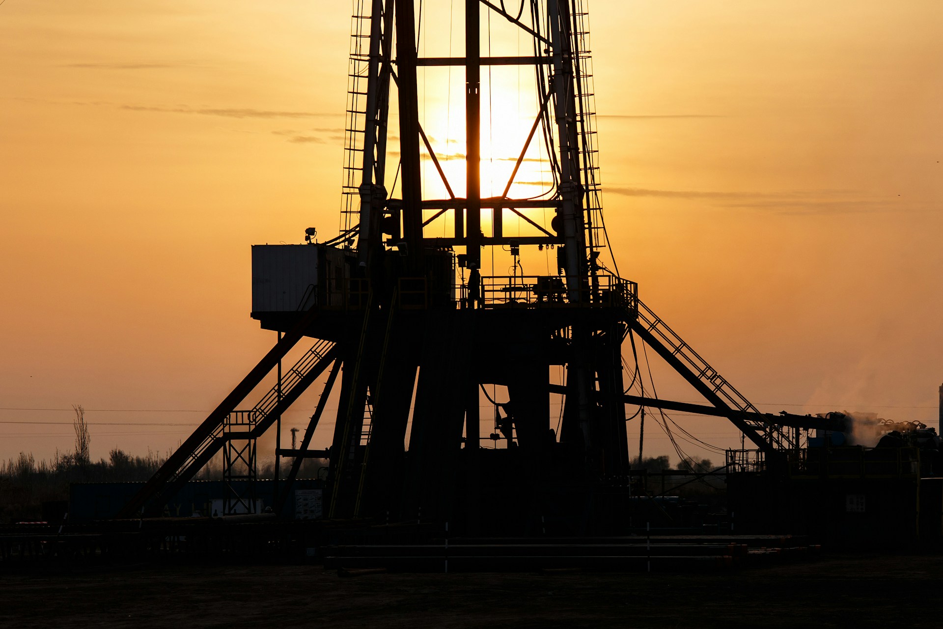 Dark oil rig in the sunset