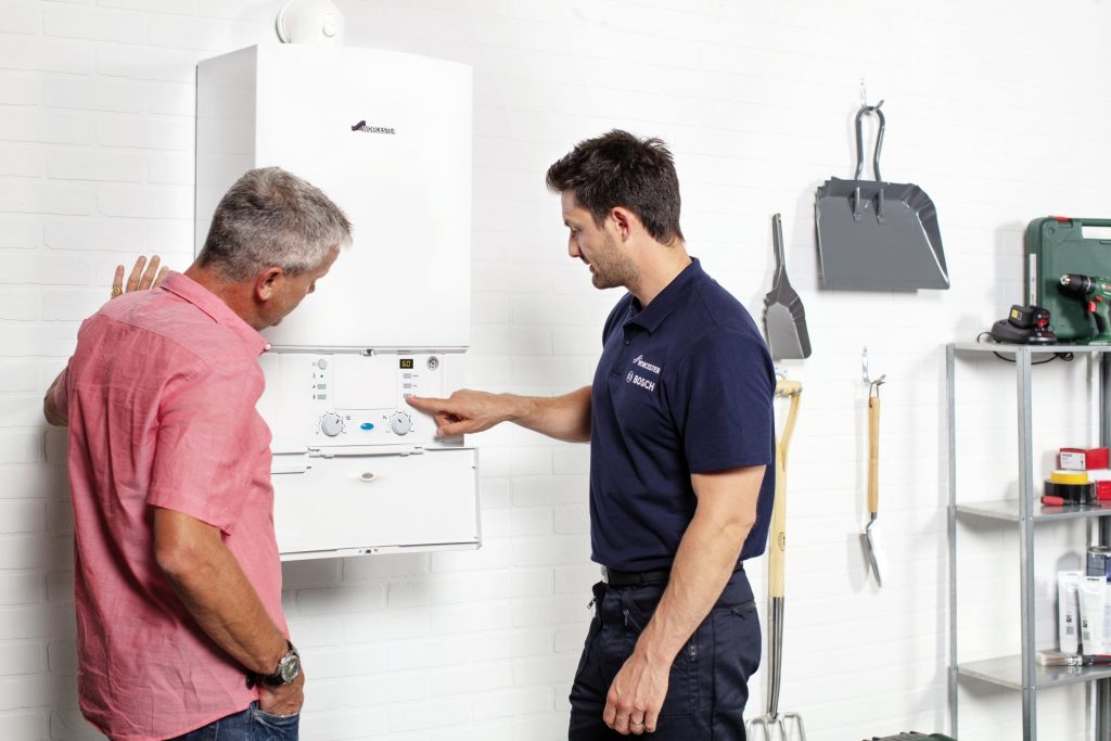 Installer explaining boiler lockout causes and potential fixes