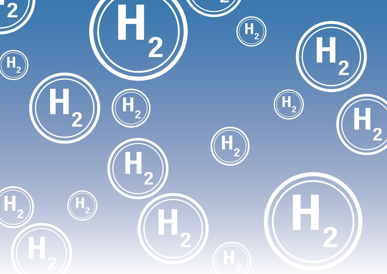 Bubbles featuring the writing 'H2' inside against a blue backdrop. Represent hydrogen.